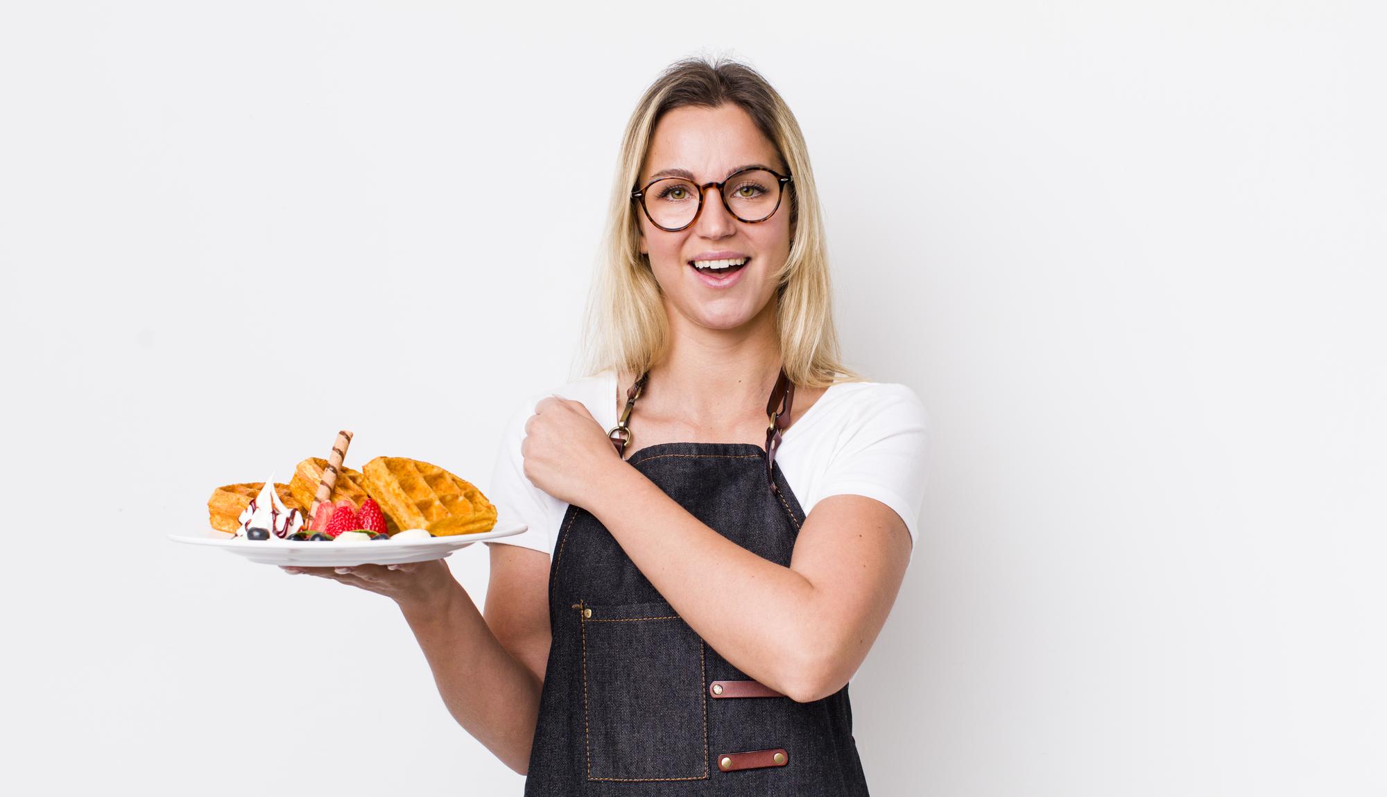 Instructor smiling holding plated meal